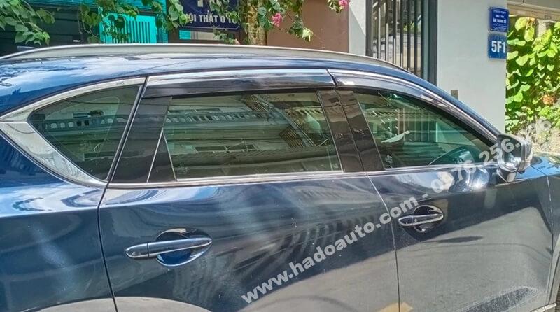 Genuine Toyota and Lexus wiper blades displayed next to an SUV, showing original car spare parts.