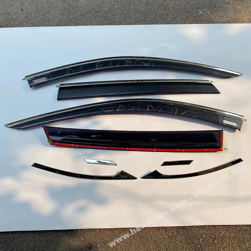 Genuine Toyota and Lexus wiper blades displayed next to an SUV, showing original car spare parts.